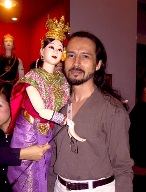 artist restoring murals as the temple complex in bangkok, july 2008