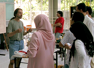john rivera-resto explaining his painting technique