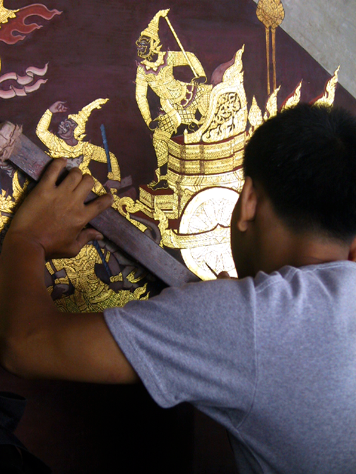 artist restoring murals as the temple complex in bangkok, july 2008