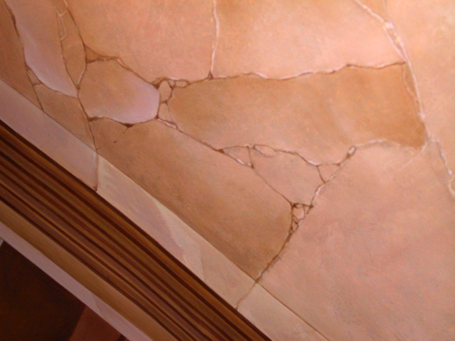 faux and real cracks being painted