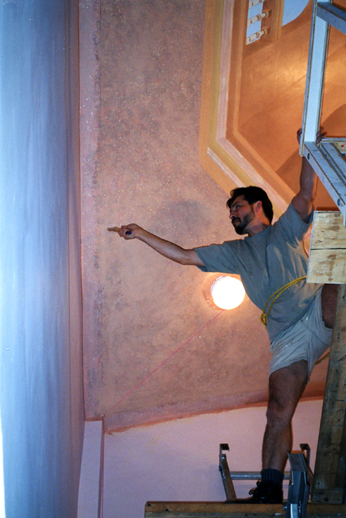 john rivera-resto atop the scaffolding's edge