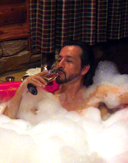 john rivera-resto enjoying life and sipping champagne in a bubbles filled hot tub, 2010