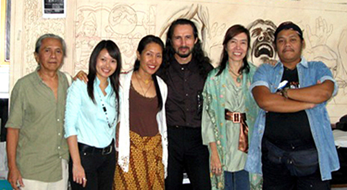 john rivera-resto posing with artists and friends at binus university